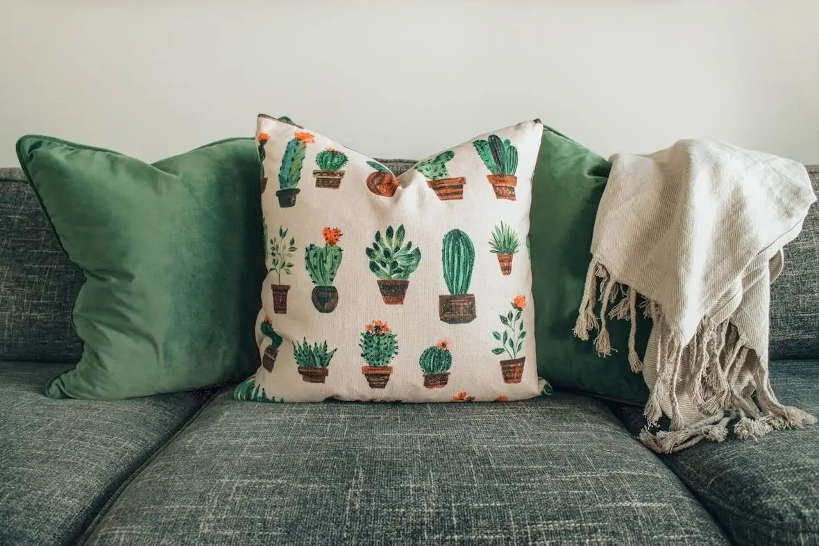 green sofa with pillows