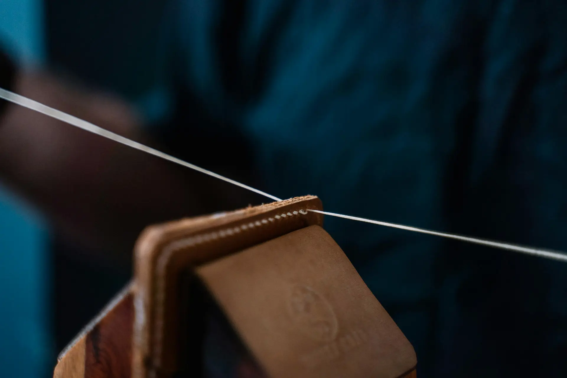 craftsman with fabric string